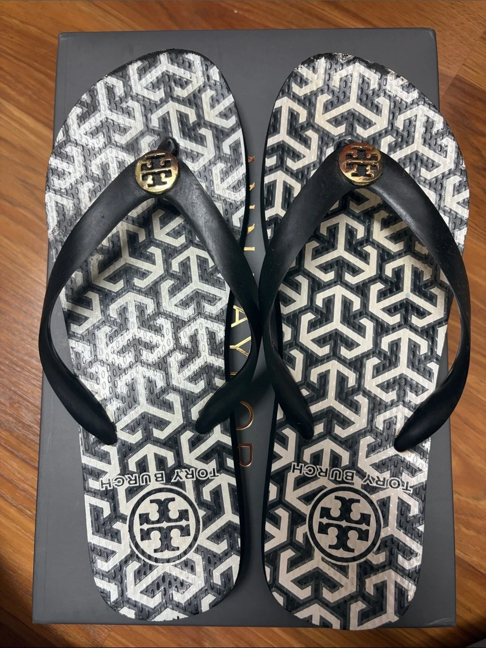 Tory Burch Black and White Logo Pattern Flip Flops with Gold Medallions